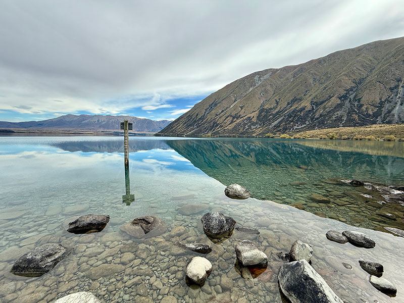 reflection of ben ohau on lake ohau